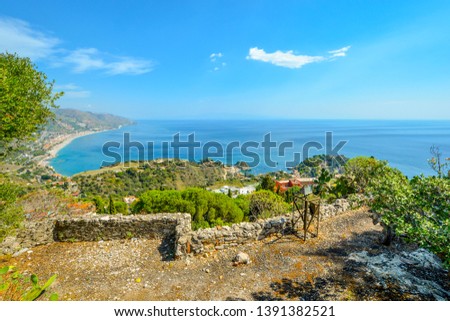View of Isola Bella island and the Mediterranean Sea from an overlooking street in Taormina Italy on the island of Sicily.