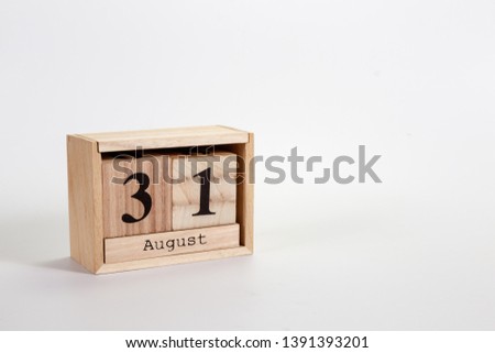 Wooden calendar August 31 on a white background close up