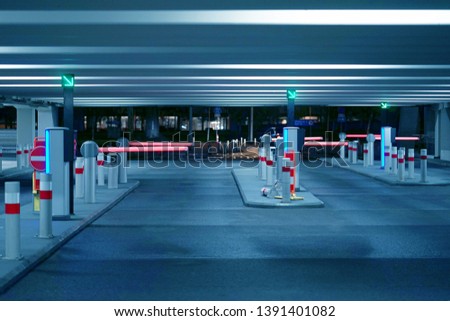 Barrier at Entrance and exit of a car Parking garage. barrier in a car park. Exit from underground parking. Underground parking/garage. Interior of parking. Toning