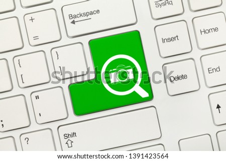 Close-up view on white conceptual keyboard - Search (green key with loupe and photo symbols)