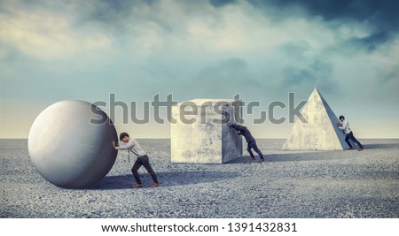 Businessman pushing the round large stone. Business heavy tasks and problems concept. differentiation between work Royalty-Free Stock Photo #1391432831