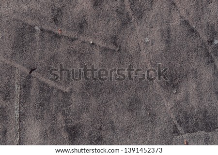 The texture of the old concrete wall with scratches, cracks, dust, crevices, roughness, stucco. Can be used as a poster or background for design.