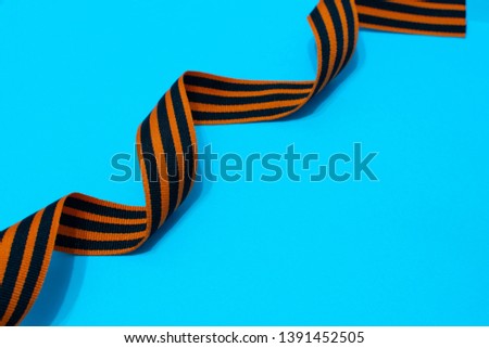 St. George's ribbon on a blue background. The symbol of the great Victory on 9 may. greeting card template