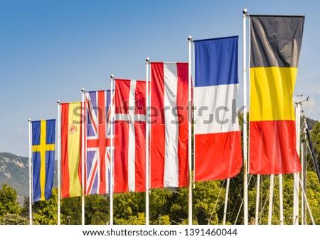 Flags of some of the Member States, including the United Kindgom, of the European Union against a blue sky