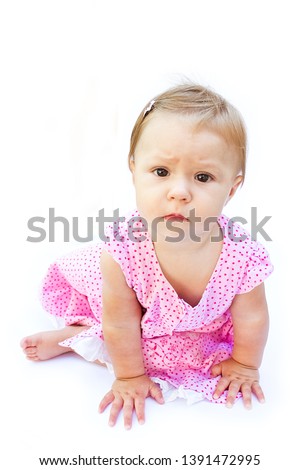 Happy beautiful little girl baby on a white background