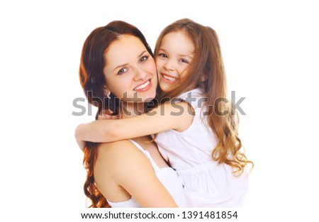 Portrait close-up happy smiling mother hugging her little child daughter on white background