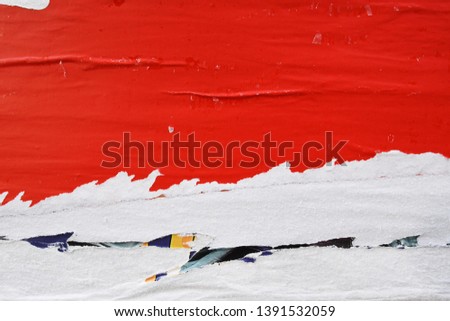 red old textured poster removed torn pulled wrenched off a street wall, ripped paper texture Royalty-Free Stock Photo #1391532059