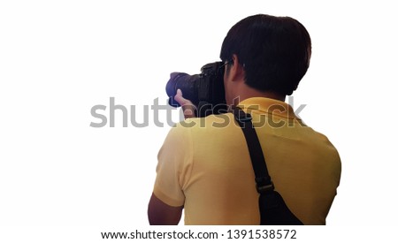 Male photographer hold camera in his hands on white background, The reporters taking a picture. the photographer looks into the camera.