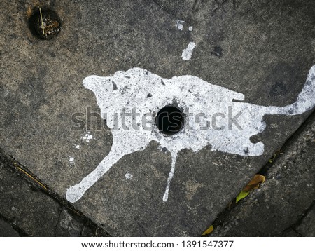 abstract dripping paint on concrete drain lid surface, brush stroke on cement floor background