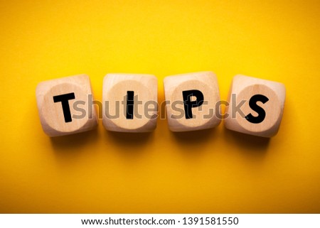 Four wooden blocks with Tips text of concept.