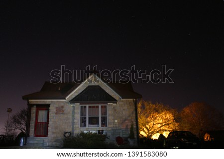 Humble little cottage on a starry night