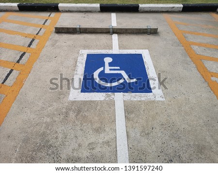 Symbol of disabled parking on the road.