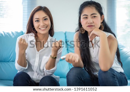 lifestyle portrait Asian women of best friends - smiling happy on sofa at living room