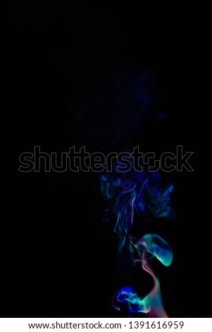 Colourful smoke on dark background 
