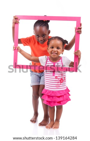 Portrait of a cute little african american girls, holding a picture frame,isolated on white background