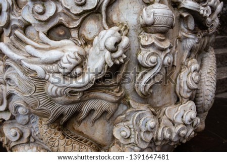 Dragon's mural carving on traditional Chinese temple on Kunming, China