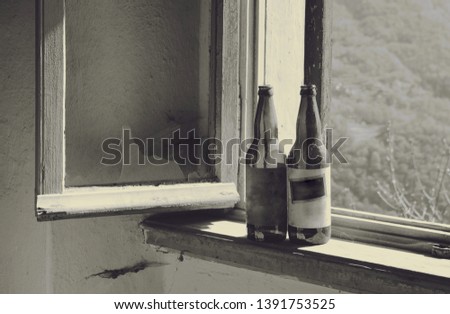 Empty beer bottles on the windowsill