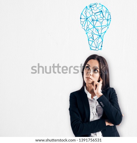 Thoughtful white businesswoman with light bulb sketch on subtle  background. Idea, innovation, inspire and solution concept 
