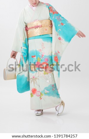 Woman in a kimono(The girls prepare a kimono known as furisode for their coming of age ceremony.)