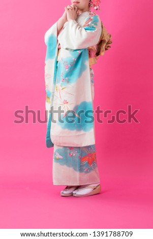 Woman in a kimono(The girls prepare a kimono known as furisode for their coming of age ceremony.)