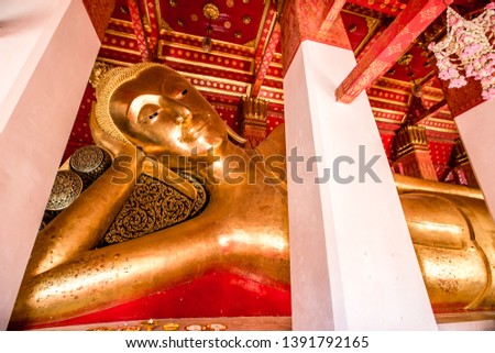 The background of the Buddha image within the church (Wat Pa Mok Worawihan-Ang Thong), has many visitors to make merit, and can take pictures without asking permission, Thailand