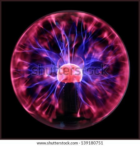 Plasma ball  with smooth magenta-blue flames isolated on a black background. Royalty-Free Stock Photo #139180751
