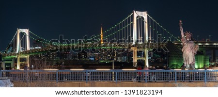Banner of Statue of Liberty and Rainbow bridge at night time, located at Odaiba Tokyo, Japan, 