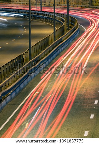 Road car light streaks. Night light painting stripes. Long exposure photography.