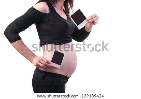 pregnant woman with Photo paper in hand