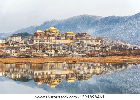 Songzanlin Temple also known as the Ganden Sumtseling Monastery, is a Tibetan Buddhist monastery in Zhongdian city( Shangri-La), Yunnan province China and is closely Potala Palace in Lhasa Royalty-Free Stock Photo #1391898461