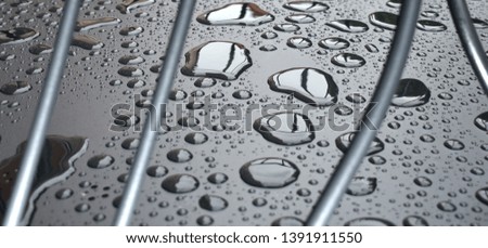 Close up water drops on metal surface can be used for web design. Abstract texture background 