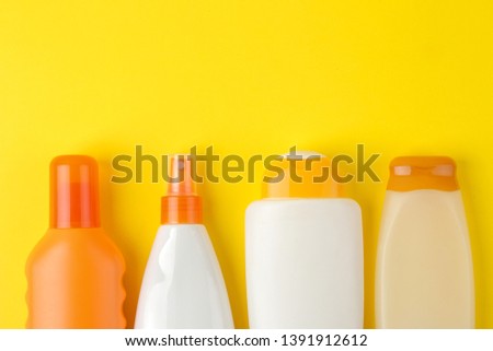 sunscreen remedy. various sunscreens on a bright yellow background. Sun protection. Ultraviolet protection. Summer. Vacation place for text. top view