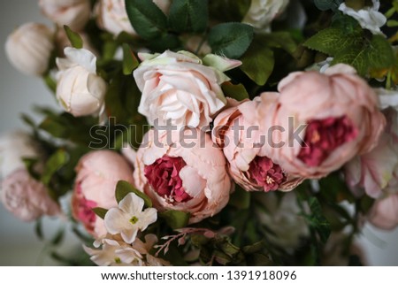 Artificial flowers peonies close-up, flowers in decor. Dusty pink color