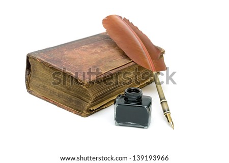 an old edition of the New Testament, an inkwell and pen isolated on a white background. horizontal photo.