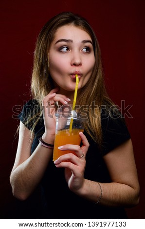 portrait of a girl with a cocktail in the Studio