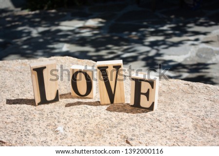 Wooden letters spelling the word LOVE