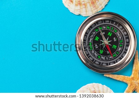 beautiful sea composition with shells and vintage compass