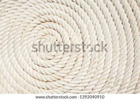 Beautiful background of rope. Spiral. Braided rope. Geometric pattern. Macrame. White rope.