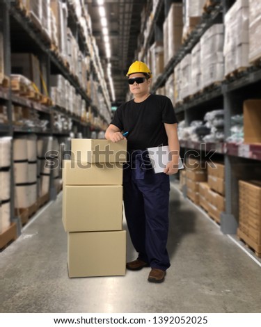 Worker Delivering products Sign the signature on the product receipt form with parcel boxes Blurred the background of the warehouse