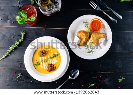 Two plates with the meal on the table. two dishes are served on the restaurant lunch, view from above Royalty-Free Stock Photo #1392062843