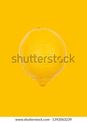 Fresh lemon levitate in air on yellow background. Concept of fruit levitation.