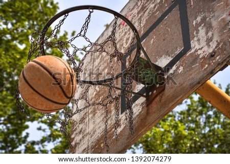 Old wooden basketball board and hoop