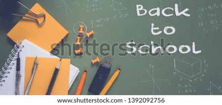 Back to school. Pattern of modern design with school supplies pencils, felt-tip pens, alarm clock, notebook and the words "Back to school", school mock-up poster on an green blackboard background