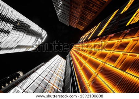 Facade of modern city building at night