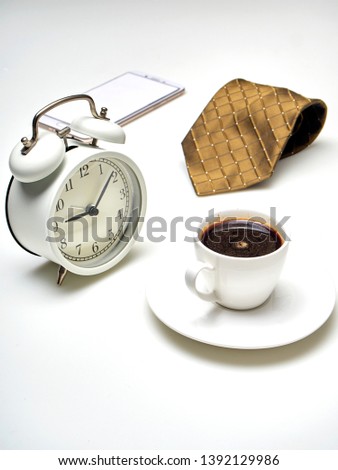 Still life, Alarm clock and necktie on white table for Father's Day or Financial business concepts, Empty space for design