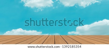 blurred natural sparkle sunny sky backdrop wall with old brown wood floorboard background for advertise,show promote product concept.