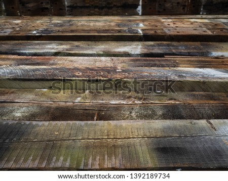 Wooden railway sleepers. Stacked on top of each other. Texture, background