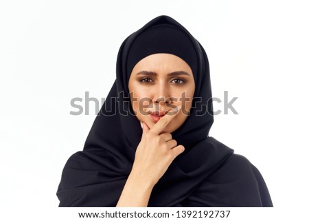  hijab woman in a black veil on an isolated white background portrait                            