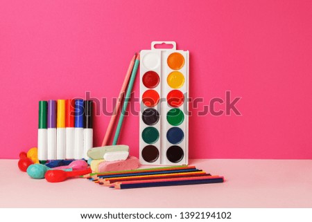 Concept Back To School Color Chalk Pencil watercolor Stationery on bright pink Background. Design Copy Space Supplies, modern vivid creative idea