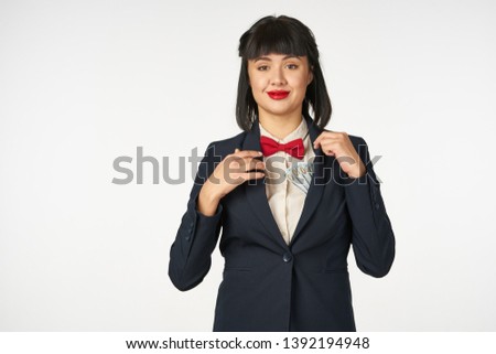   woman in a suit on a light background                           